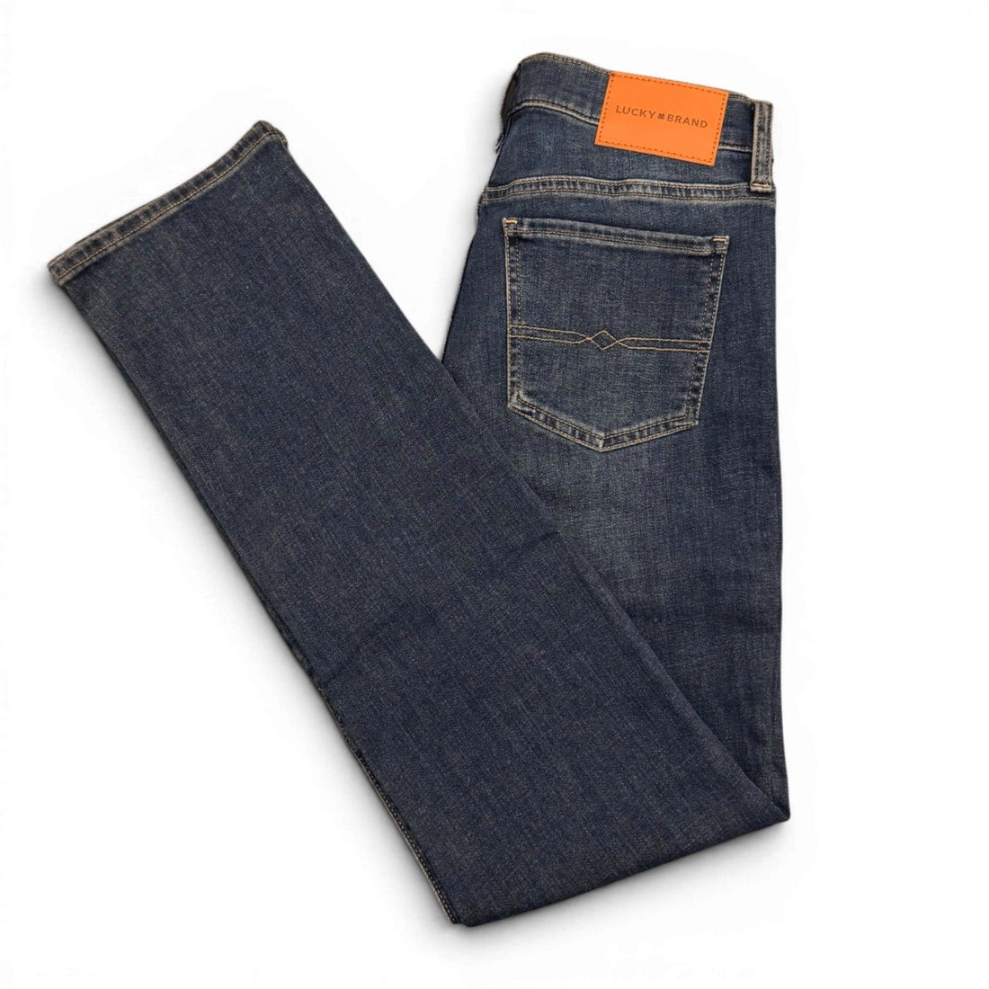 Supplier catalog photograph showing the back pockets and denim fabric of Lucky Brand straight-leg jeans